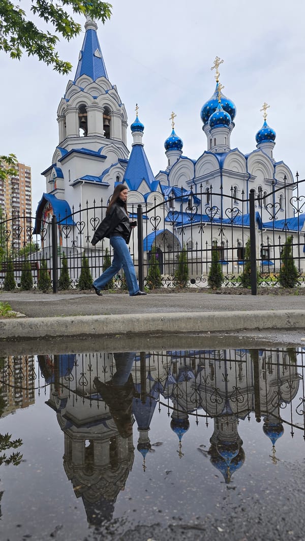 Morning walk captures post-rain Kyiv gardens, church, playground