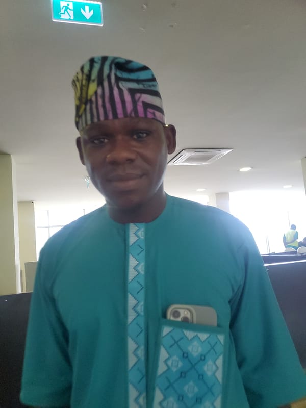 Morning office routine documented in Gwagwada, Nigeria workplace