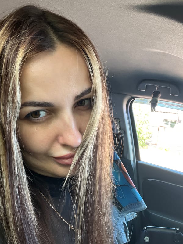 Woman takes car selfies during late night drive