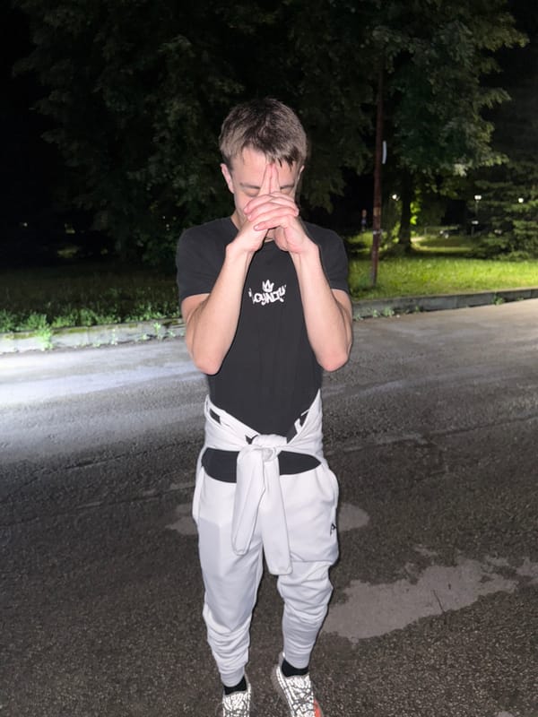 Young men gather for nighttime photos in Sevlievo, Bulgaria