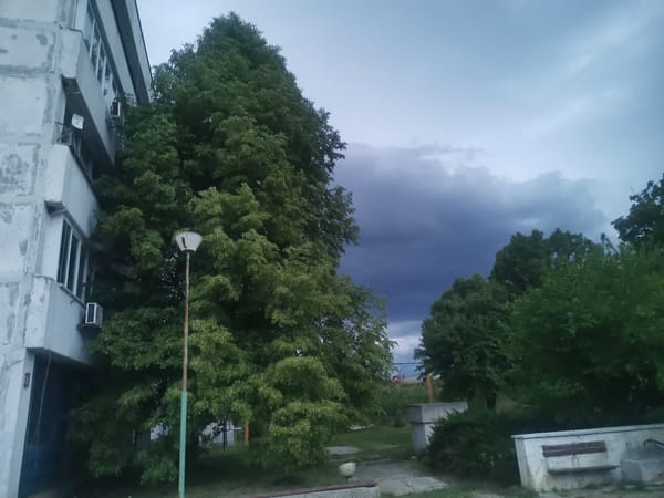 Storm clouds gather over rural Bulgarian village