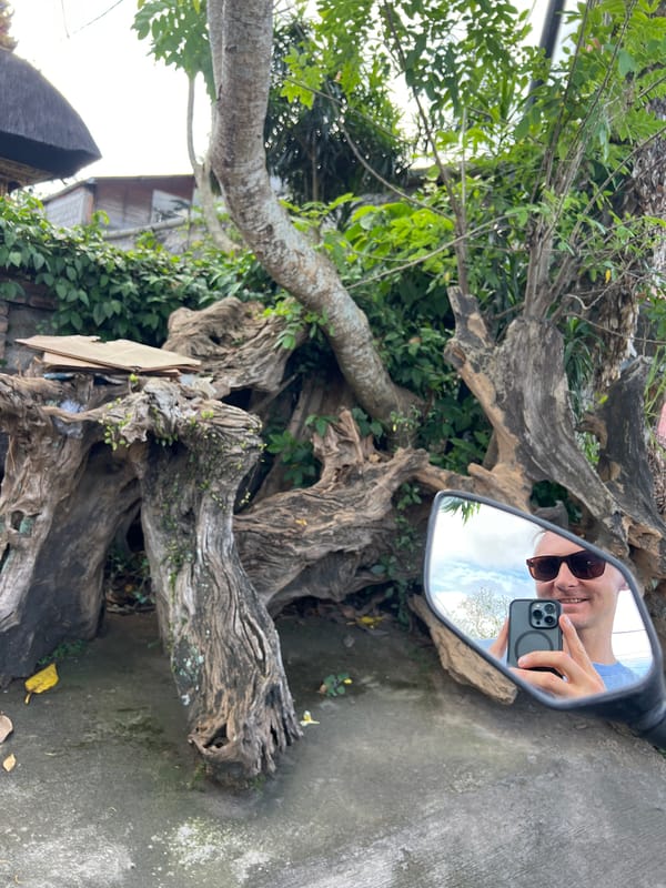 Tourist documents morning exploration of Ubud's streets and culture