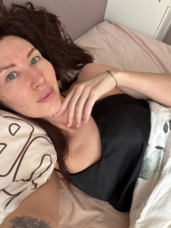 Woman takes morning selfie in bed in Perm