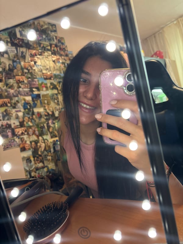 Woman takes selfies at vanity mirror in Veliko Tarnovo