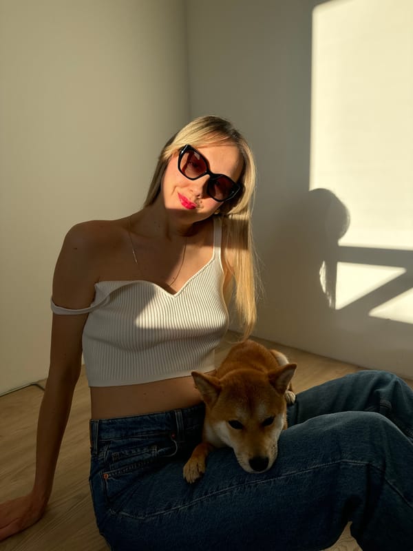Woman poses with Shiba Inu during casual photo session