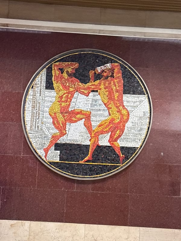 Metro station artwork and train arrival documented in Shushary