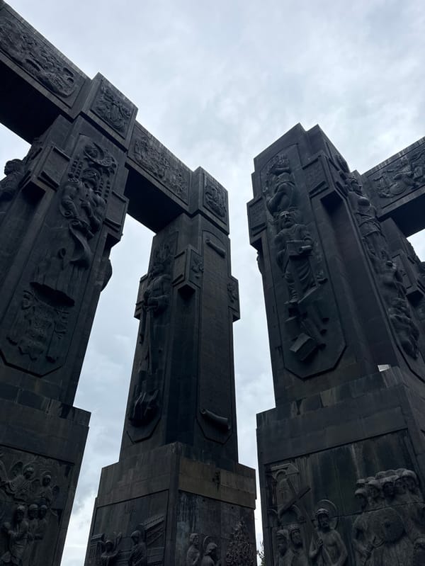 Tourist documents Chronicle of Georgia monument, Tbilisi landmarks
