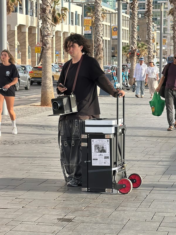 Photographer with suitcase spotted on Tel Aviv street