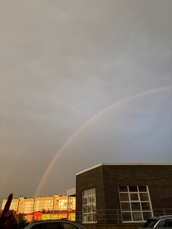 Double rainbow over Mikhaylovsk apartment blocks after summer rain
