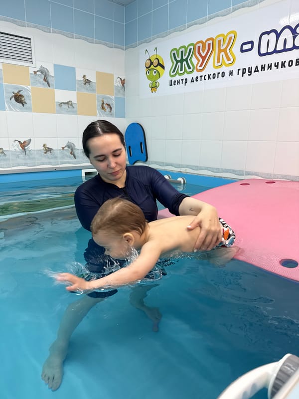 Swimming lesson observed between woman and child in Russia
