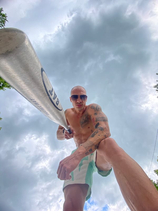Tattooed man with baseball bat photographed near car in Bulgaria