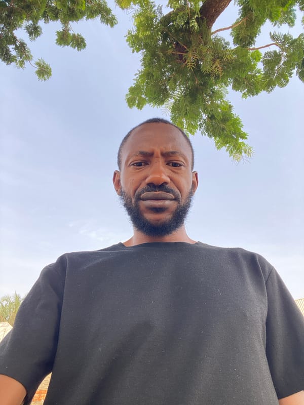 Man takes selfies outdoors in Sabon Tasha, Nigeria