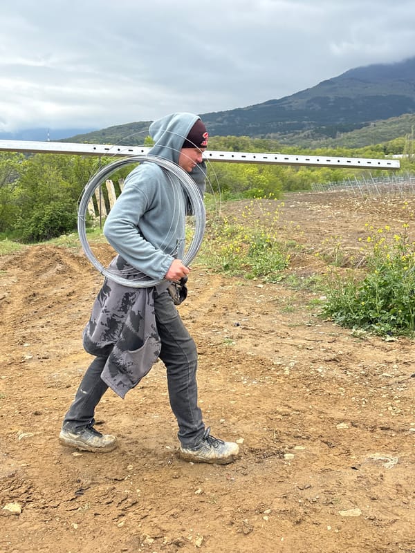 Workers take muddy field break in Pushkino Ukraine