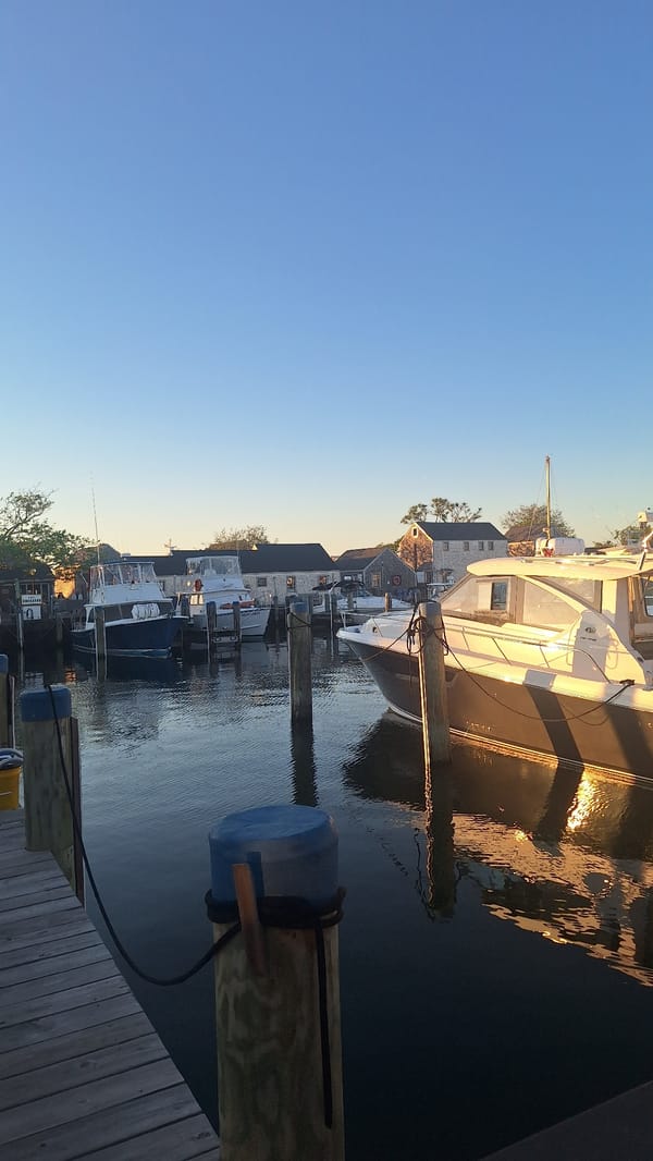 Sunset harbor views from Nantucket marina and wooden piers