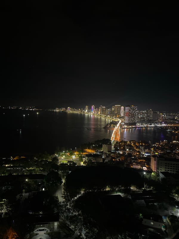 Aerial nighttime city views captured showing waterfront urban development
