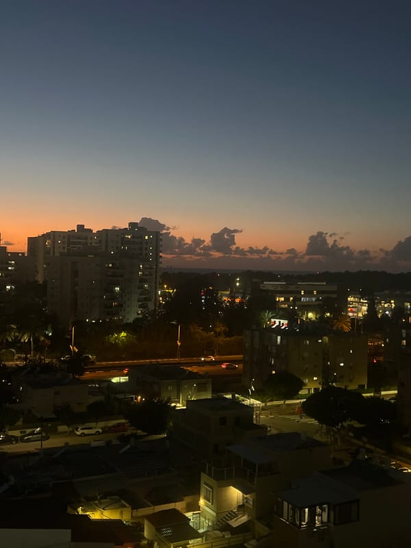 Nighttime aerial views captured over illuminated Kiryat Bialik skyline