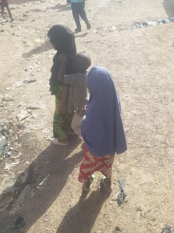 Daily water collection scenes documented in Dutsinma B, Nigeria