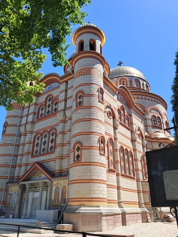 Ice cream and street life near a grand domed church