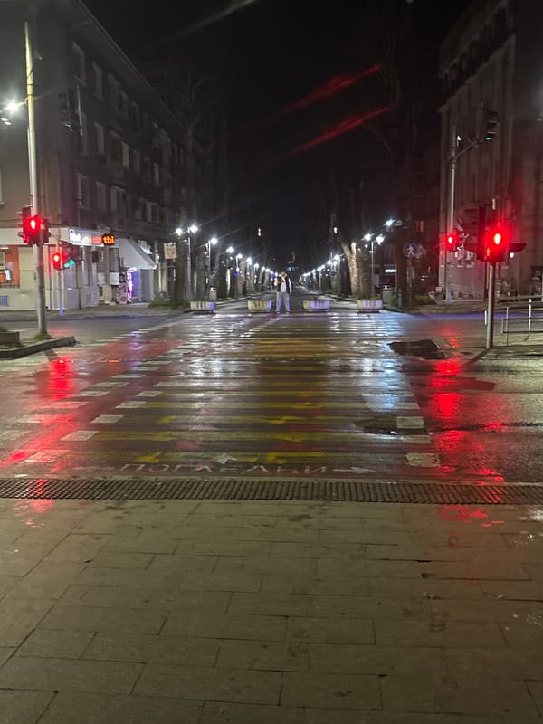 Wet nighttime street scene documented in Burgas, Bulgaria