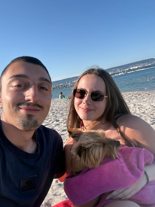 Couple enjoys beach day with dog in Varna, Bulgaria