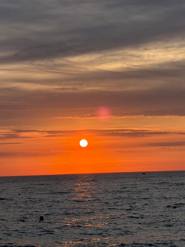 Sunset on the Russian coast, people hanging out nearby