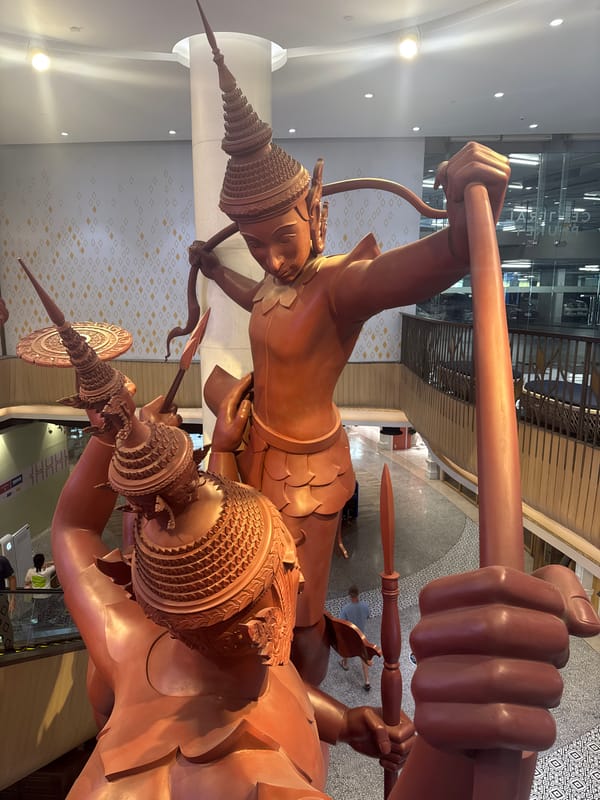 Inside a decorated Wichit mall with Thai sculpture and floral art