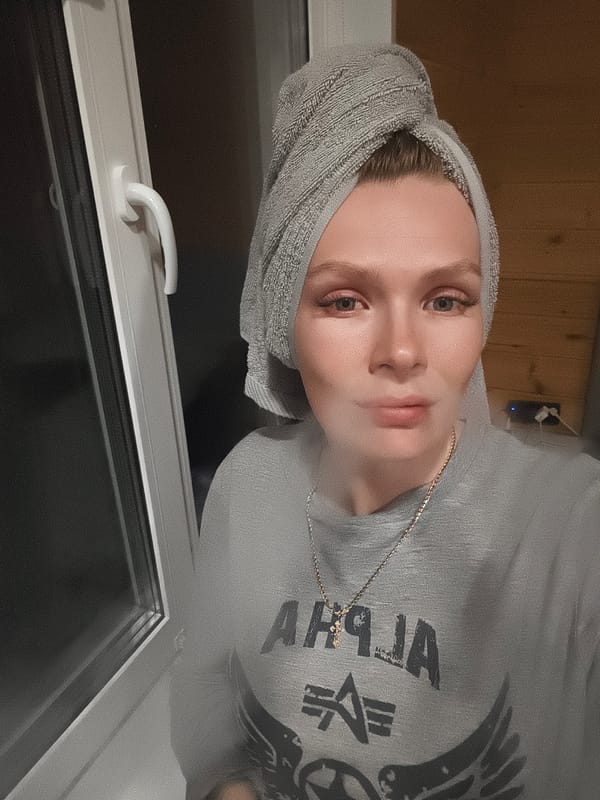 Woman takes selfies with cat in Russian village