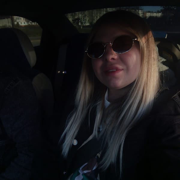 Woman travels through urban and rural areas as car passenger