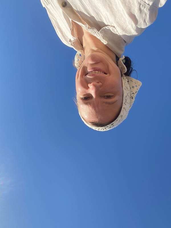 Woman enjoys sunny morning at Kama Reservoir beach in Russia