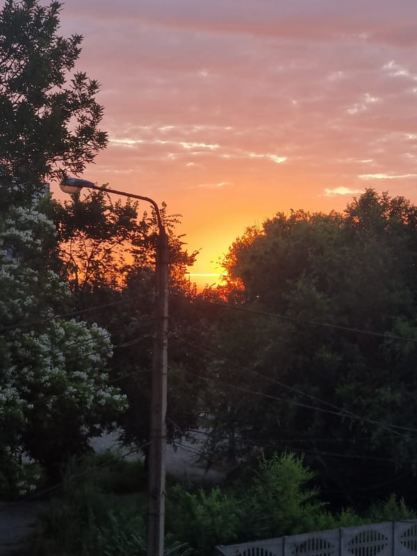 Sunset colors fill the sky over Kryvyi Rih residential area