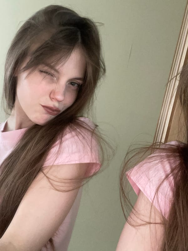 Woman takes selfie indoors in Ufa, Russia