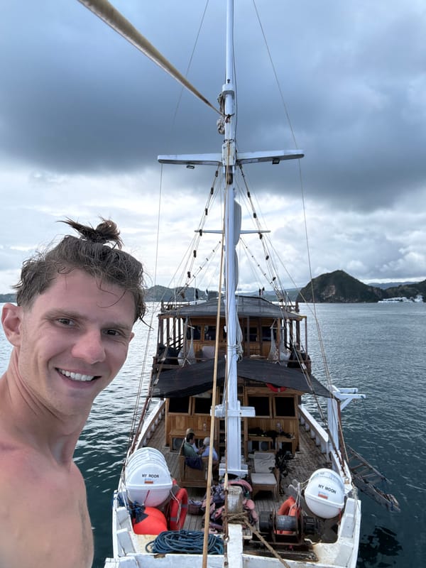 Man takes boat selfies near Pasir Putih, Indonesia