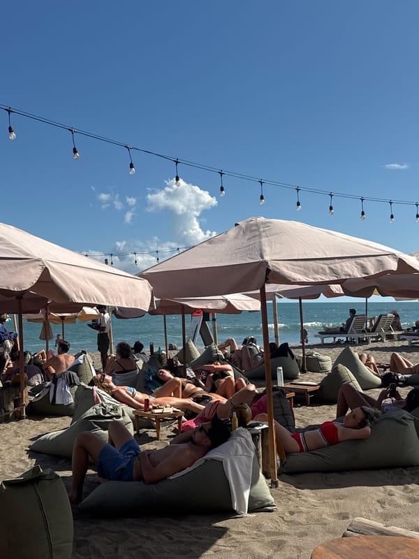 Beach day unfolds at North Kuta with loungers, surfboards