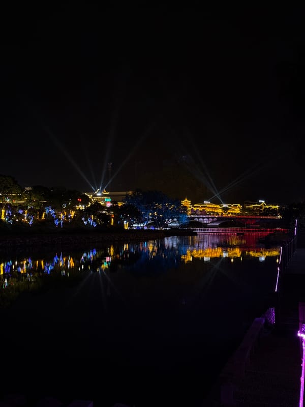 Nighttime light display illuminates Wulingyuan waterfront architecture
