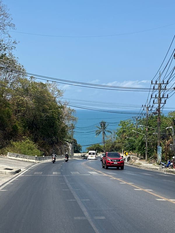 Morning traffic observed on coastal road in Thailand