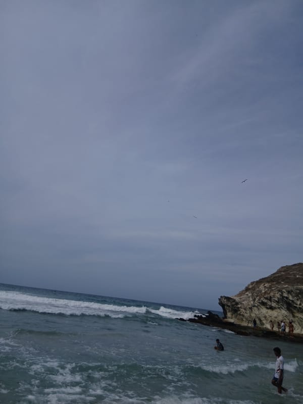 Weekend beach activities continue under cloudy skies at Venezuelan coast