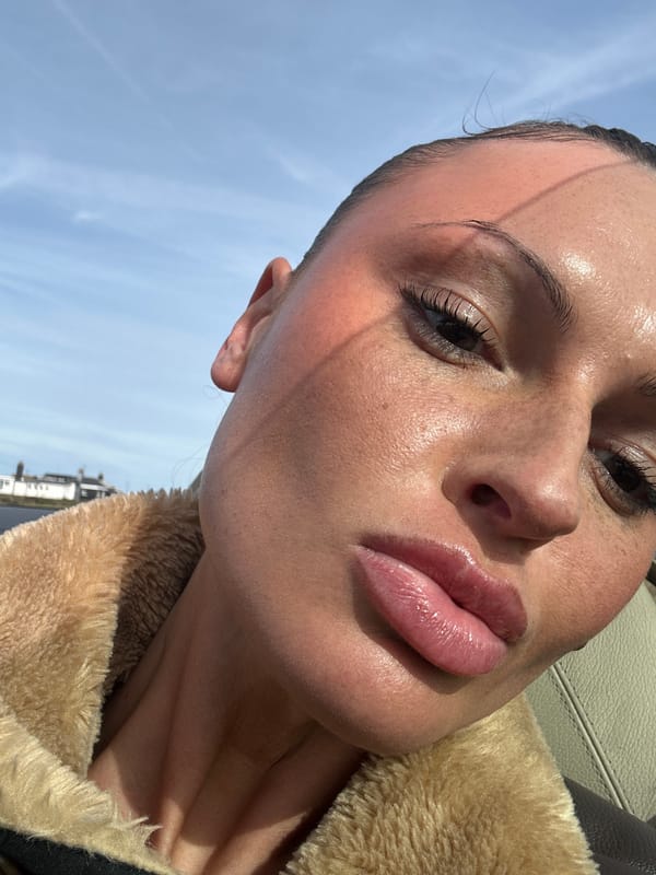 Visitor documents seaside afternoon at Folkestone pebble beach