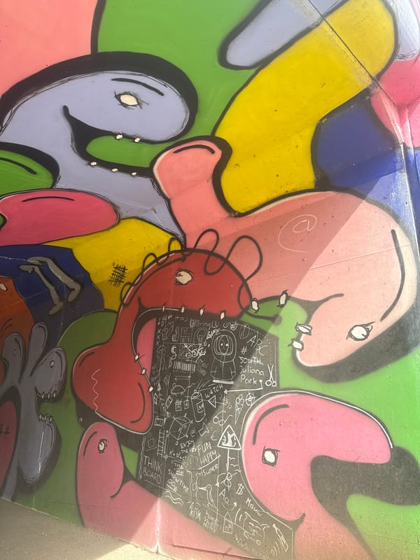 Woman holds baby outdoors in Veghel garden setting