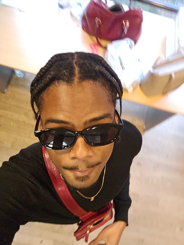 Person with braided hair spotted at Paris cafe