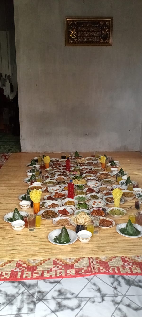 Traditional communal meal gathering documented in Lhokseumawe, Indonesia