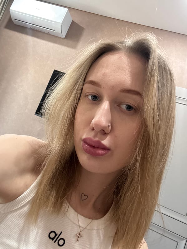 Woman takes selfies indoors in Ovoshchnoy, Russia