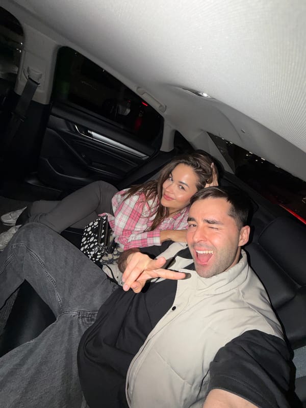 Man poses with peace sign in car photo, Langfang