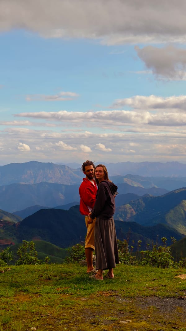 Tourists photograph scenic mountain views in Xín Vàng, Vietnam
