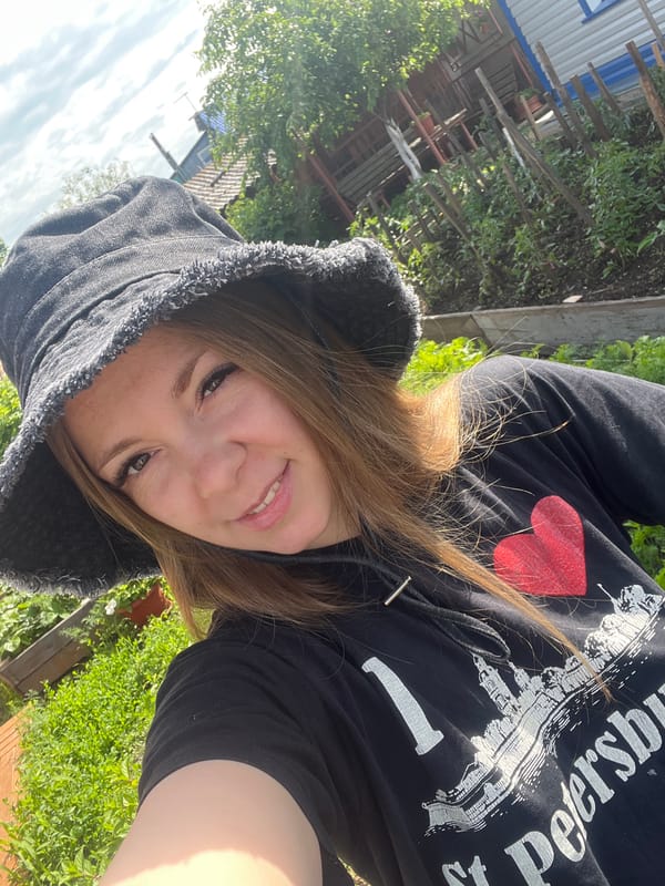 Woman takes garden selfies in St. Petersburg shirt, Shadrinsk