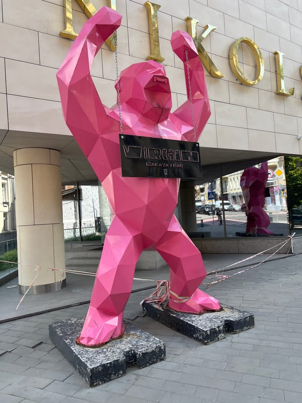 Pink gorilla sculpture outside a Kharkiv street-level building