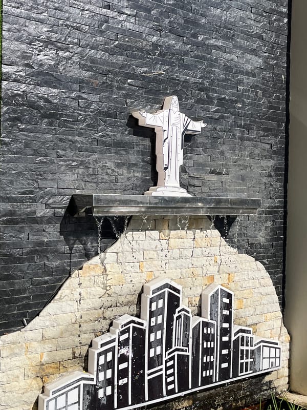 Stone-tiled architectural wall installation observed in urban setting