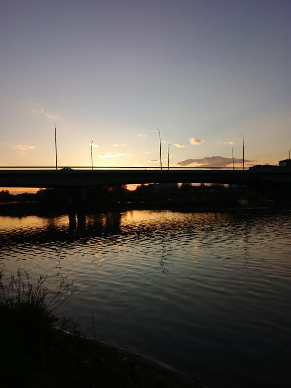 Witness captures colorful waterside sunrise or sunset scene