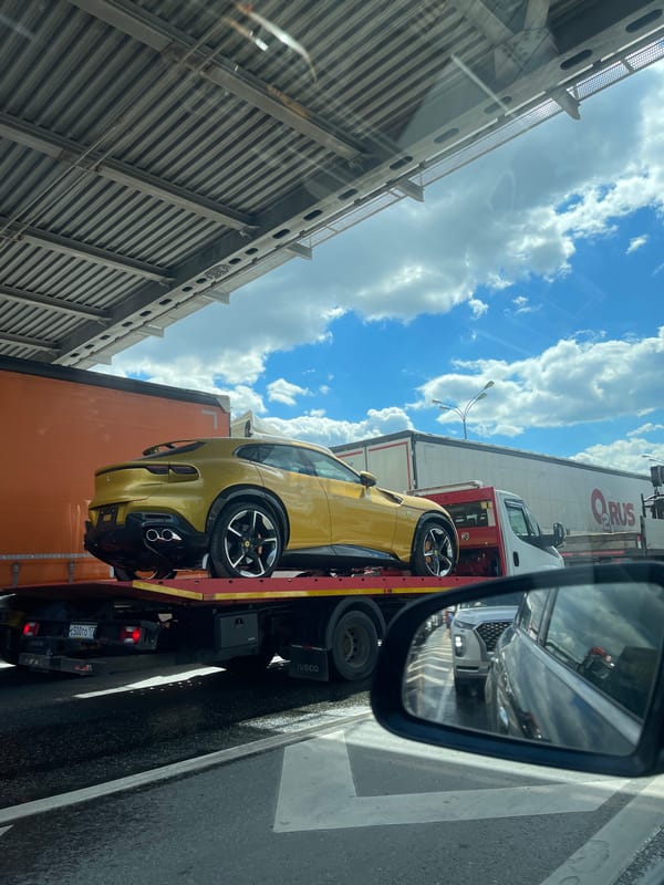 Yellow Ferrari Purosangue hauled on flatbed near Moscow