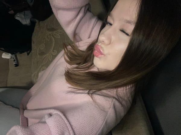 Woman in pink sweater documented in casual moments, Chaikovsky