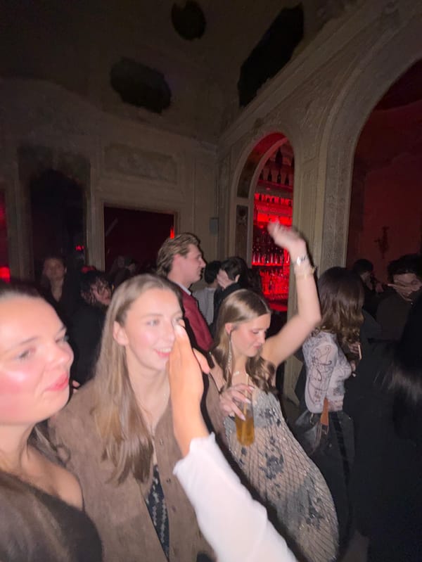 Late-night social gathering documented in Paris venue